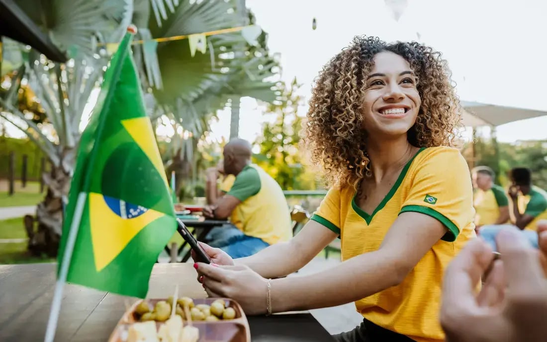 A soccer fan checking out live blog match updates on their smartphone.